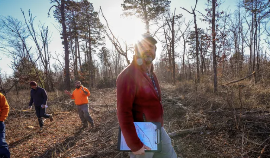 URI forestry specialist Christopher Riely is co-directing Rhode Island's component of a U.S.-Canadian forest ecosystem project. David DelPoio/The Providence Journal